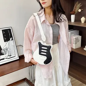 Creative guitar-shaped crossbody bag in black and white with a stylish wide strap