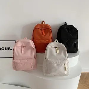 Minimalist school backpack for girls in pink, orange, beige and black colors