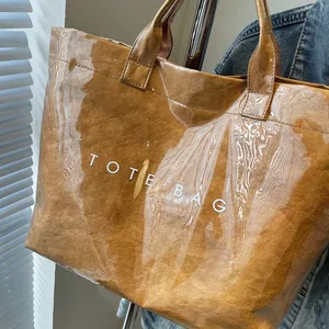 Detail of waterproof PVC outer layer and brown paper texture on large tote bag