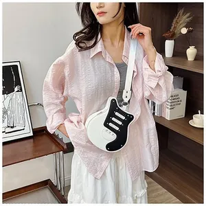 Creative electric guitar shaped crossbody bag with black and white leather finish and strap