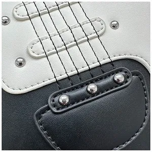 Close-up of guitar-shaped bag showing premium leather texture and metallic rivet details