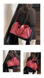 Detailed views of dark red leather tote bag with large capacity and dual handle straps