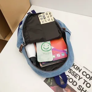 Vintage light blue denim backpack with large capacity for laptop and daily essentials