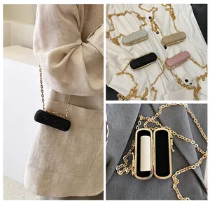 Mini rhinestone cylinder evening clutch showing multiple colors and interior lipstick storage
