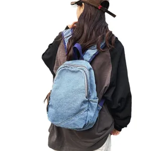 Retro washed denim large capacity backpack for women featuring canvas straps and leather puller