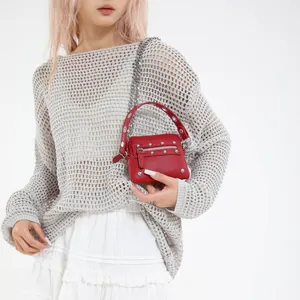 Red leather mini motorcycle crossbody bag with silver studs and metal chain strap