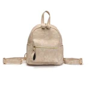 Mini beige floral jacquard backpack with golden zippers and adjustable straps