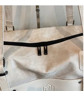 Detail of travel bag showing smooth double metal zippers and premium twill fabric texture