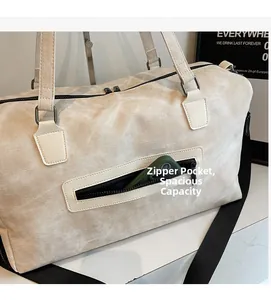 Detail of travel bag side zipper pocket showing ample storage space for a smartphone