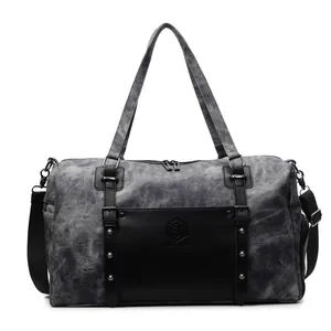Bolsa de viaje de lona gris con bolsillo frontal de cuero negro y correa ajustable