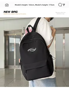 Side view of the black waterproof backpack on a model showing large storage capacity