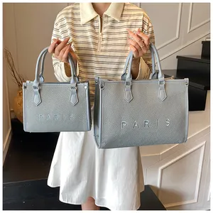 Detail of light blue woven tote bag set with Paris embroidery and large capacity