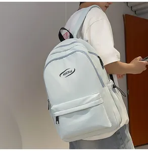 Lifestyle shot of light blue large capacity backpack with side pocket on shoulder