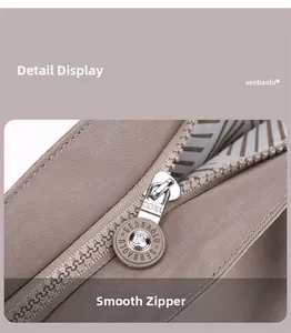 Macro view of smooth silver metal zipper and fine fabric texture on nylon handbag