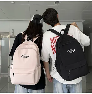 Detail view of the black and pink minimalist backpacks with MRMIBAG logo for students