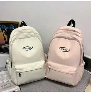 Detailed view of the water-resistant nylon backpack with side pockets and front zipper