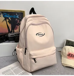 Minimalist cream backpack with MRMIBAG logo featuring large pockets and side drawstring