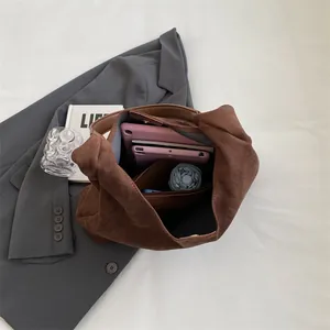 Brown suede tote bag with large capacity interior showing organized daily essentials