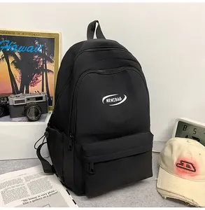 Detail of black MRMIBAG backpack showing durable matte texture and large front pocket