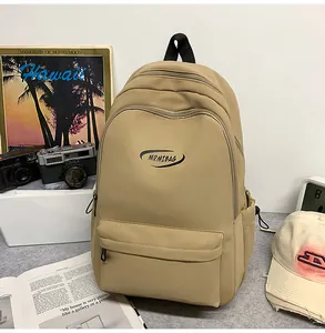 Close-up of tan multi-pocket backpack with MRMIBAG logo and durable zippers