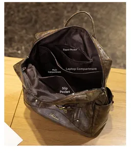 Structure interne du sac à dos vintage en cuir montrant le compartiment pour ordinateur