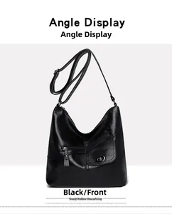 Detailed front view of black leather shoulder bag with zipper and turn-lock pocket