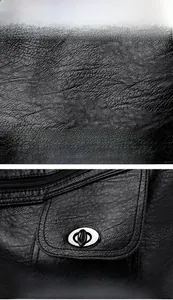 Close-up of black pebbled leather texture and elegant rotary lock hardware detail