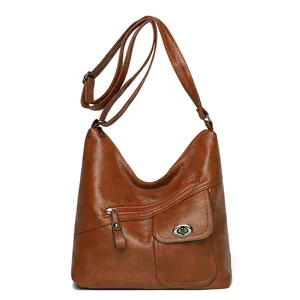Vintage brown PU leather shoulder bag with multi-pocket design and adjustable strap