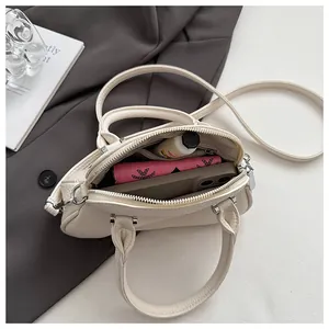 Top view of cream white tote bag interior with compartments for phone and wallet