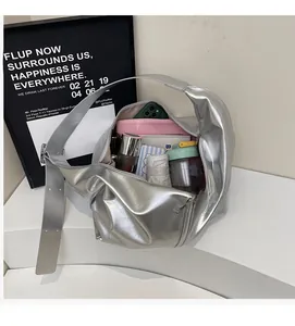 Spacious interior of silver metallic tote bag showing large capacity for essentials