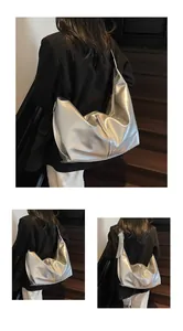 Detail view of large silver metallic hobo bag featuring liquid-like glossy texture