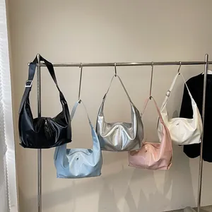 Large capacity tote bags in five colors hanging with adjustable shoulder straps