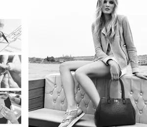 Detail view of crocodile pattern handbag and sneakers featuring craft sewing process