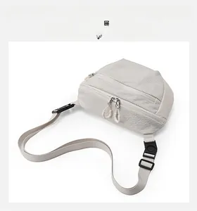 Top view of off-white crossbody bag showing grid fabric texture and zipper details