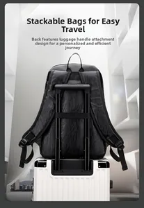 Black leather backpack featuring a back strap designed for secure luggage handle attachment