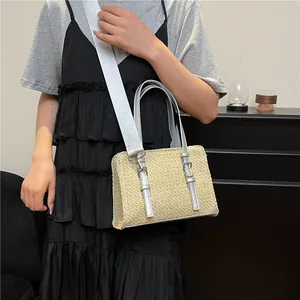 Women's straw woven handbag for summer beach with silver leather accents and shoulder strap
