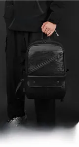 Macro view of black leather texture with slanted zipper pocket and trendy metal hardware
