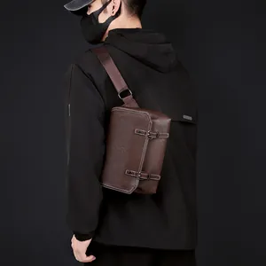 Detail view of brown PU leather crossbody bag with vintage texture and metal buckles
