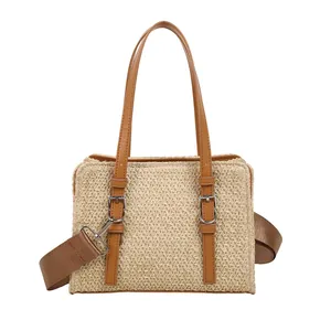 Straw woven handbag with brown leather straps and adjustable crossbody strap for beach