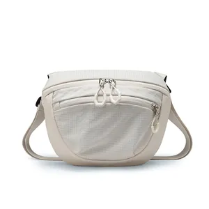 Lightweight waterproof crossbody bag in cream white for casual outdoor and commute use