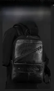 Detail of black leather backpack featuring diagonal zipper and flap pocket for men