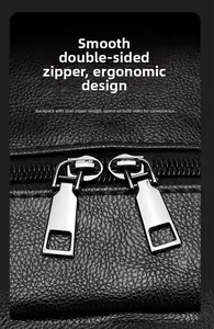 Macro shot of silver dual metal zippers on premium textured black leather backpack
