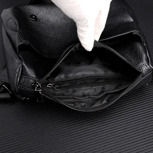 Macro shot of waterproof PU messenger bag featuring layered pockets and black chrome zippers