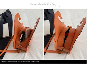 Internal storage detail of orange pumpkin bag showing capacity for phone and power bank
