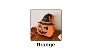 Detail of pumpkin-shaped Halloween crossbody bag featuring a black wizard hat accessory