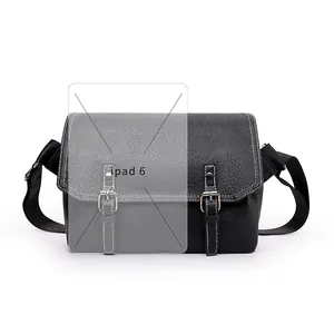 Detail of black PU messenger bag with white stitching showing iPad 6 fitting inside
