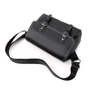 Waterproof black PU leather messenger bag with white stitching and double buckle straps