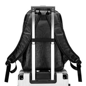 Fashionable black leather travel backpack with trolley strap for luggage attachment