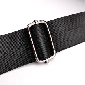 Macro detail of high-density black nylon strap with silver metal adjustment buckle