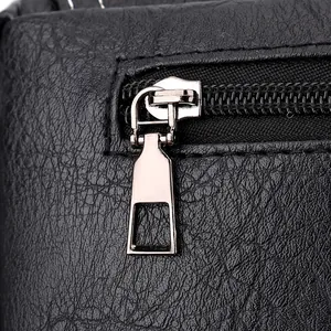 Close-up of waterproof PU leather texture and durable silver metal zipper on business bag